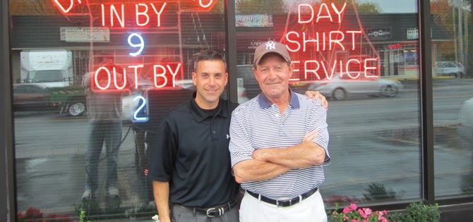 John Ritter Jr. poses with John Ritter Sr. outside Ritter's Cleaners in North Syracuse